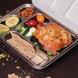 Nestling 5 compartment stainless steel bento lunch box with ciabatta sandwich, crackers, fruit, almonds, vegetable salad all separated by compartments